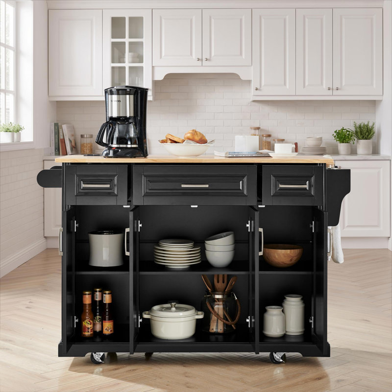 Chariot de cuisine roulant noir de 120 cm (47,2 pouces) avec plateau en bois d'hévéa naturel, abattant pliable, trois tiroirs, quatre portes d'armoire à panneaux, étagère latérale, barre porte-serviettes et roulettes verrouillables pour le rangement de la cuisine.