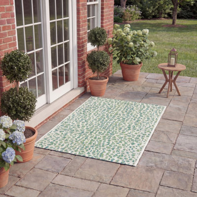 Tapis intérieur / extérieur ivoire / vert à imprimé animal