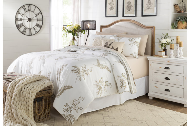 bedroom with metal roman numeral wall clock