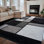 Tapis gris / blanc / noir à motif géométrique Astika