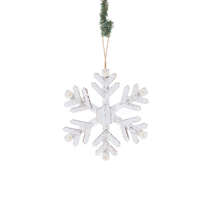 Flocon de neige blanc suspendu en bois blanc délavé