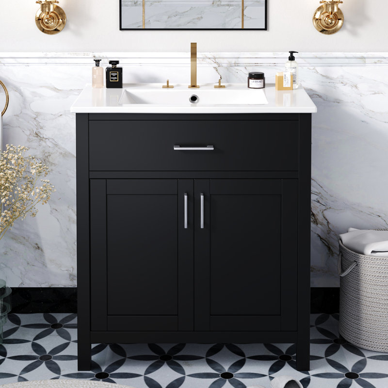 Meuble-lavabo noir de 30 pouces avec lavabo en céramique et nombreux espaces de rangement. Fabriqué en bois massif. Offre des tiroirs pratiques. Finition moderne pour une unité. Fonction de fermeture en douceur