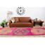 Tapis de style bohémien avec un motif de motif géométrique rose et orange dans une jolie nuance de couleurs