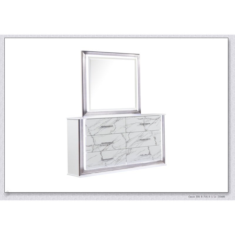 Commode Desire avec façades de tiroirs en marbre, finition blanche élégante, poignées métalliques et six tiroirs spacieux pour un rangement élégant dans la chambre à coucher