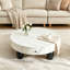 Table basse ronde moderne de 90 cm avec tiroir de rangement, plateau blanc et pieds sculpturaux noirs