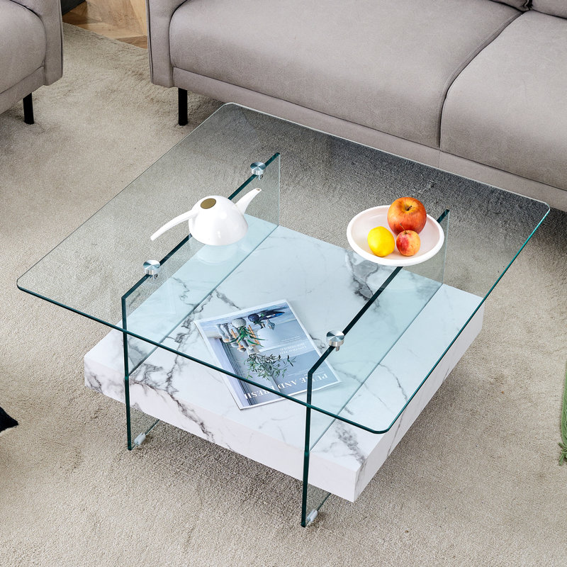 Table basse carrée moderne de 31,4 pouces à deux niveaux - une combinaison élégante de verre transparent et d'autocollant en marbre. Elle peut être utilisée comme table basse, table d'appoint ou présentoir.