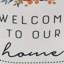 Arrêt de porte en tissu Welcome to Our Home avec poignée en corde