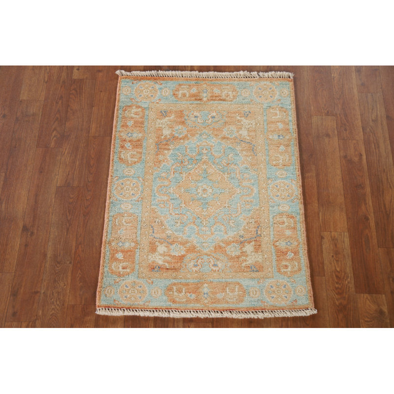 Tapis turquoise et orange Oushak