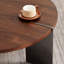 Table basse en bois de noyer de forme ronde - Pieds en métal noir, surface décorative vieillie brun foncé avec plateau et pieds pour le style
