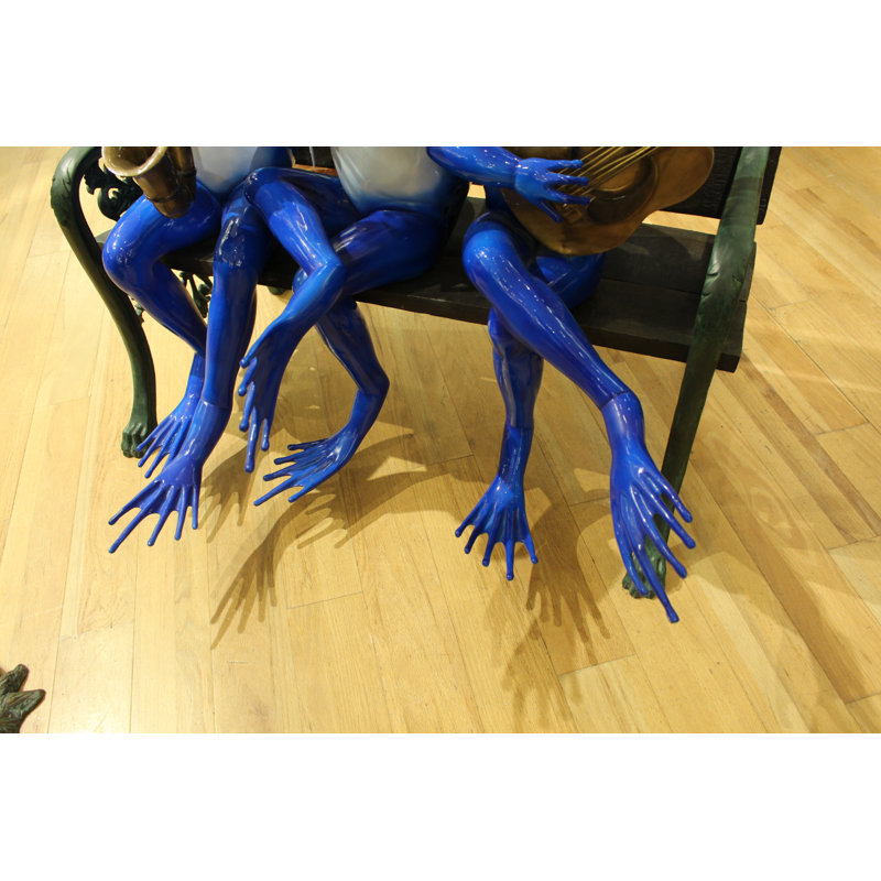 Statue de grenouilles musicales sur un banc Florentina