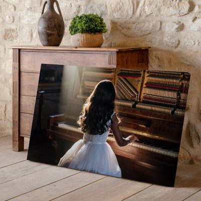 Toile, "A Young Girl In A Flowing White Dress Sits At Wall Art An Antique Piano Her Back To The Viewer As She For Modern Home Decor", art sur toile