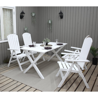 Capuano 4 - Person Solid Wood Patio Dining Set Rectangular Table