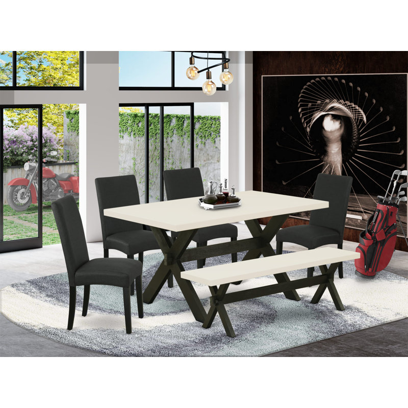 L'ensemble de table de salle à manger 6 pièces comprend une table de cuisine rectangulaire avec pieds en X et 4 chaises Parson en tissu de couleur noire avec banc, finition noire brossée