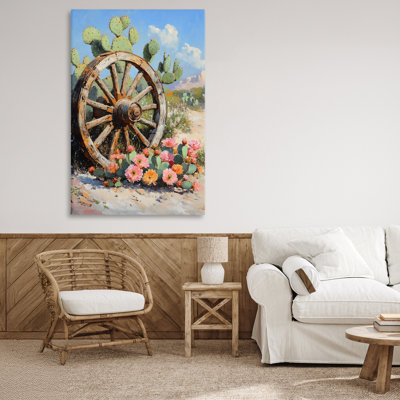 Roue de chariot parmi des toiles de cactus, design par Franklyn Gregory