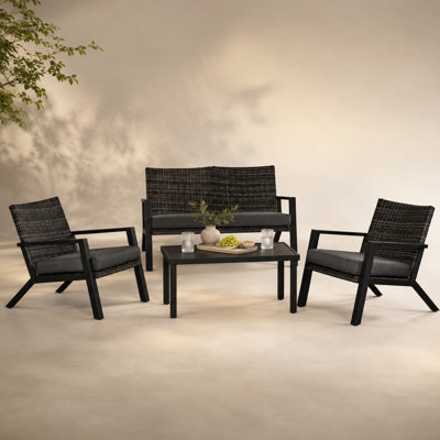 Ensemble de conversation d'extérieur en rotin 4 pièces avec causeuse, chaises et table basse