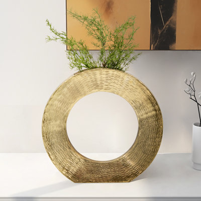 Aluminum Vase with Circular Cut-Out Design and Textured Surface.
