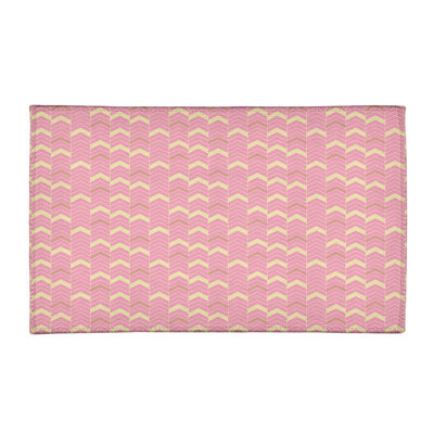 Tapis rose/ivoire à chevrons