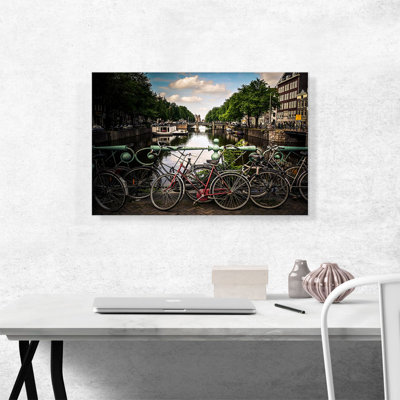" Bikes On A Bridge Canal Of Amsterdam Netherlands "