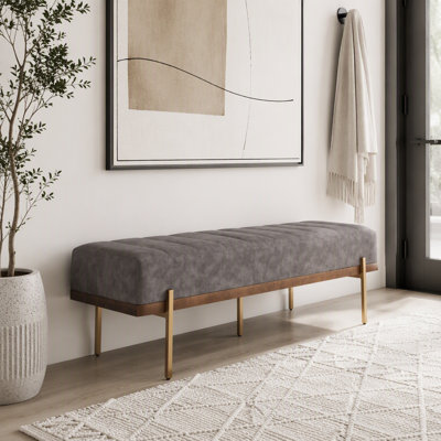 Banquette rembourrée capitonnée avec pieds dorés