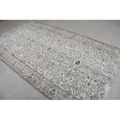 Tapis élégant en laine blanche à motif floral élégant de 6,6 x 9,7 pi