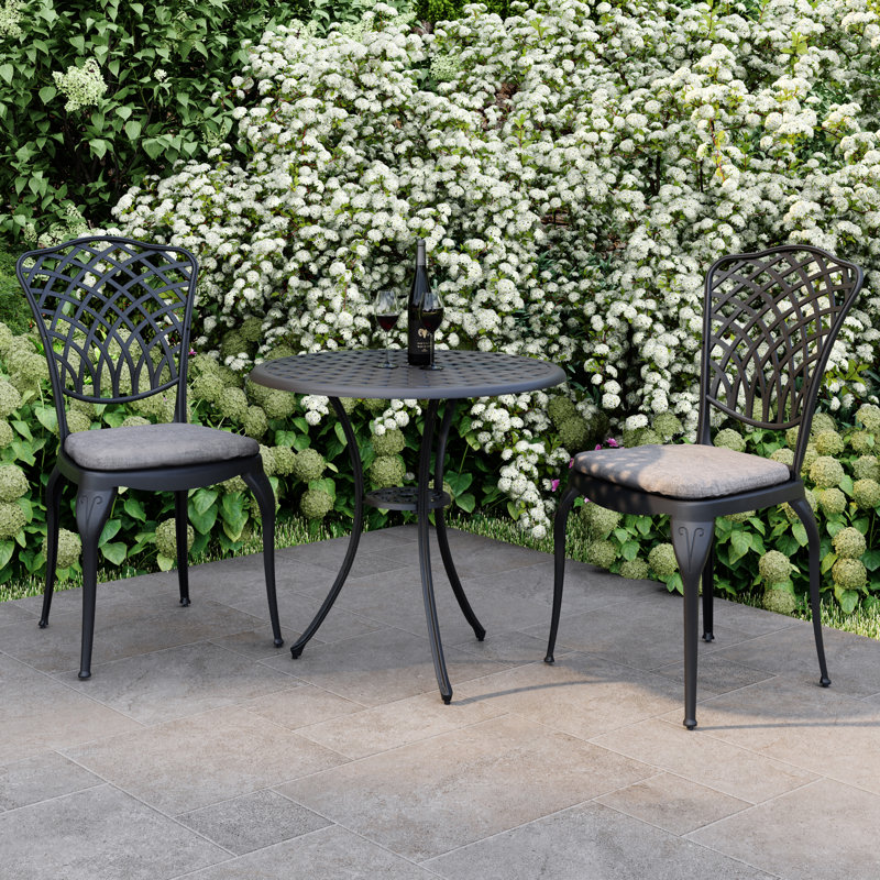 Ymir 2 - Person Patio Dining Set with Round Table , Cushions Included