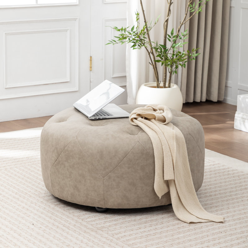 Castanedo Upholstered Round Ottoman, Polyester - Taupe
