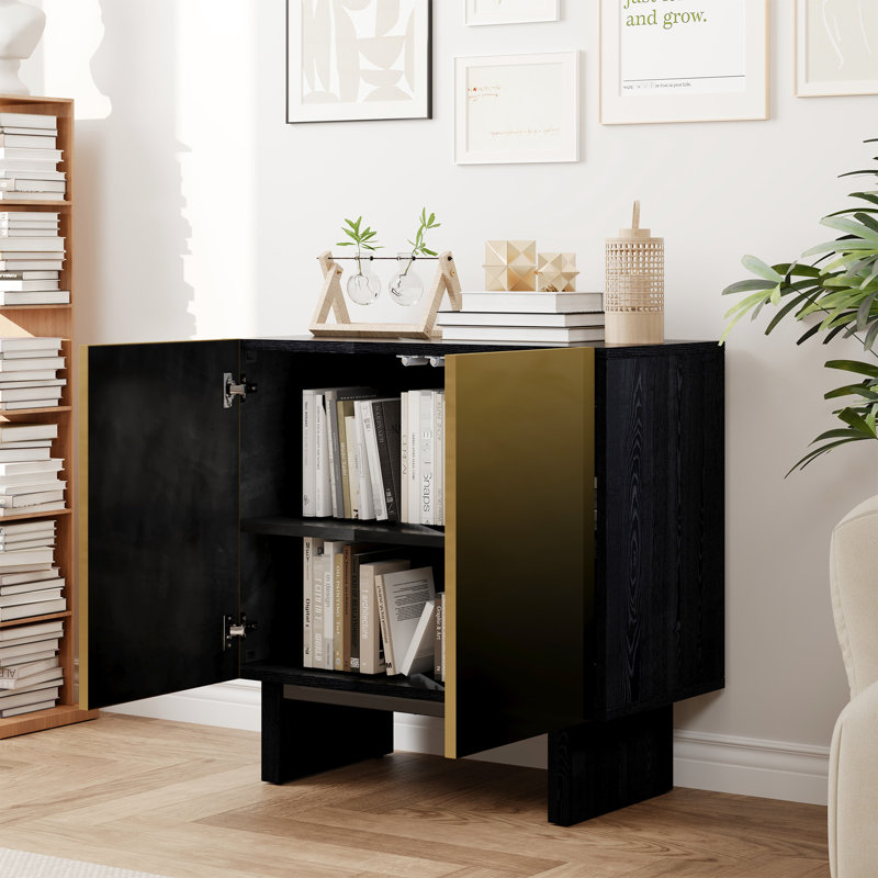 Armoire décorative à 2 portes en noir mat avec détails dorés, fonction d'ouverture par pression, tablettes réglables pour un grand rangement de magazines et d'accessoires, idéale comme rangement de buffet ou de couloir,