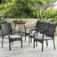 De 4 chaises empilables en PE gris, structure en fer et coussins d'eau pour un patio extérieur de style confort