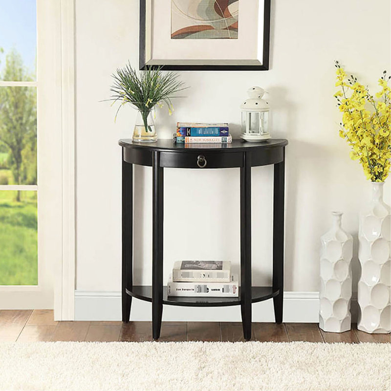 La console demi-lune noire est idéale pour le rangement et la décoration.