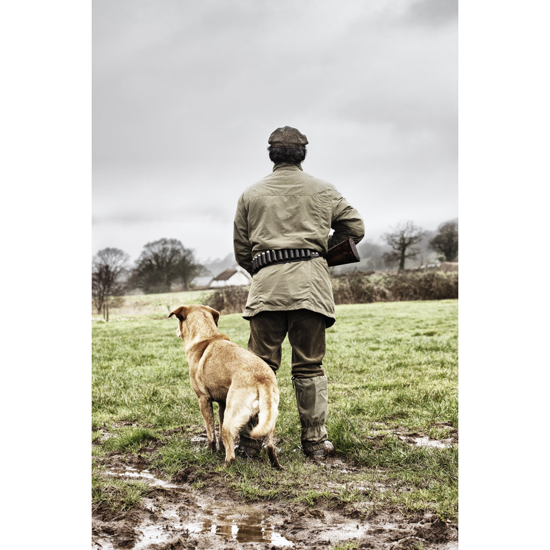 Jäger mit seinem Hund