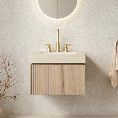 Meuble-lavabo flottant avec comptoir en pierre frittée, cuve en céramique, armoire en contreplaqué, portes à fermeture en douceur et trous de robinet pré-percés pour une installation sans effort.