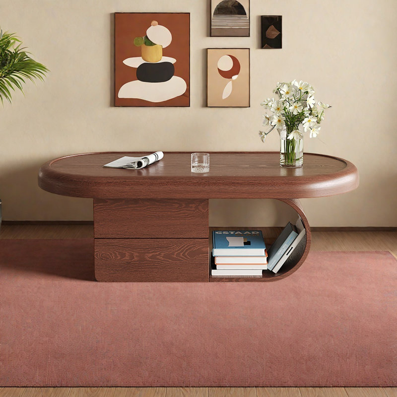 Une table basse ovale de style moyen en couleur noyer, H 16,5 po x L 43,3 po x l 23,6 po