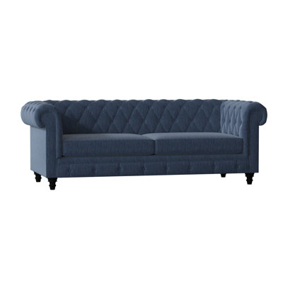 Canapé Chesterfield à accoudoirs roulés
