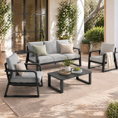 Ensemble de conversation pour patio contemporain en aluminium avec canapé, chaises, table basse et coussins