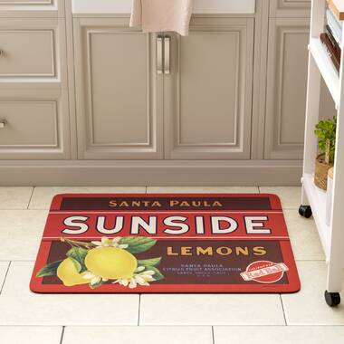 Rooster and Lemoms floorcloth in front of the refrigerator