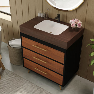 Meuble-lavabo sur pied avec lavabo en céramique, comptoir en pierre frittée à chaud, construction stable et compatibilité avec robinetterie standard. Installation de plomberie flexible.