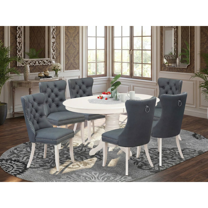 L'ensemble de salle à manger comprend une table de cuisine ovale avec rallonge amovible et 6 chaises rembourrées, lin blanc