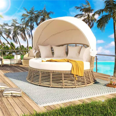 Lit de jour rond beige pour terrasse avec auvent rétractable, coussins amovibles et confortables, auvent ajustable pour se détendre.