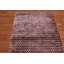 Tapis mauve touffeté à la main