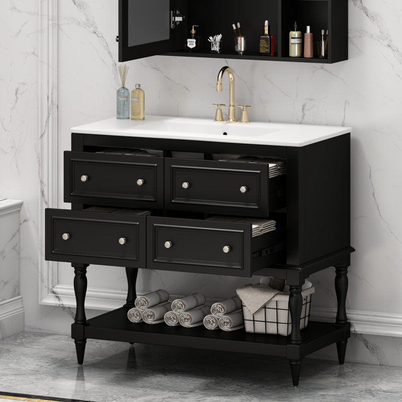 Meuble-lavabo de 36 po avec lavabo - finition noire. Structure en bois massif, rangement à 4 tiroirs. Lavabo en céramique encastré. Ajout élégant. Facile à assembler et à structurer. Tiroirs. Bassin. Décoration élégante. Assemblage