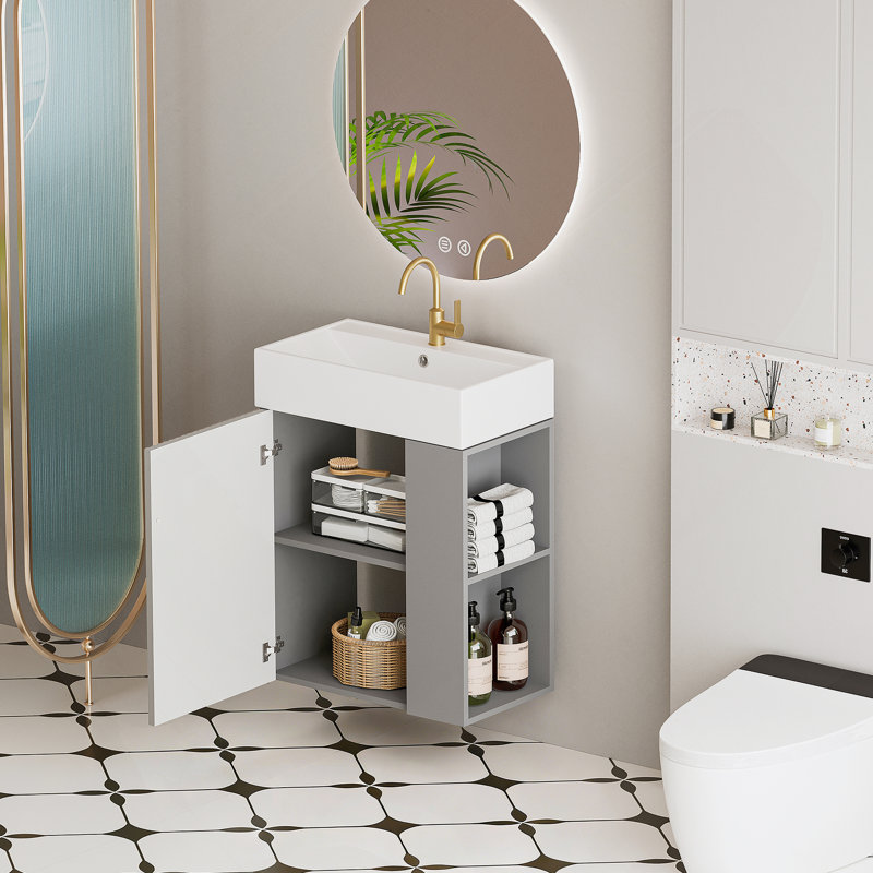 Meuble-lavabo mural de 21,6 pouces avec lavabo en céramique, porte à fermeture en douceur et tablette de rangement flottante pour les salles de bain modernes.