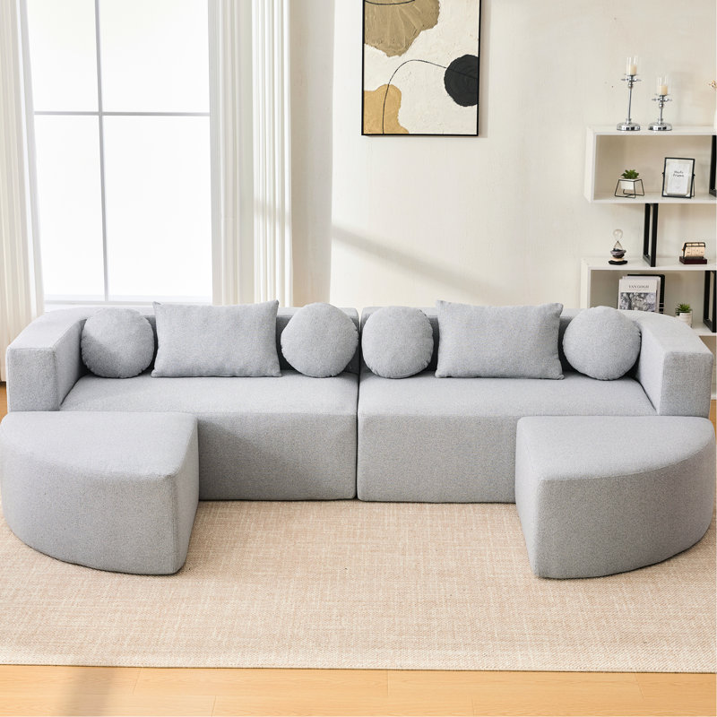 114,9 po de forme modulaire désossée avec des extrémités arrondies, des sièges profonds et des coussins de soutien en tissu bouclé gris
