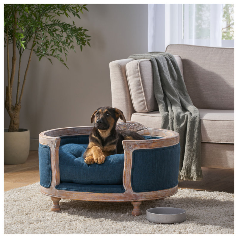 Lit pour chien luxueux capitonné bleu marine avec cadre en bois de bouleau massif