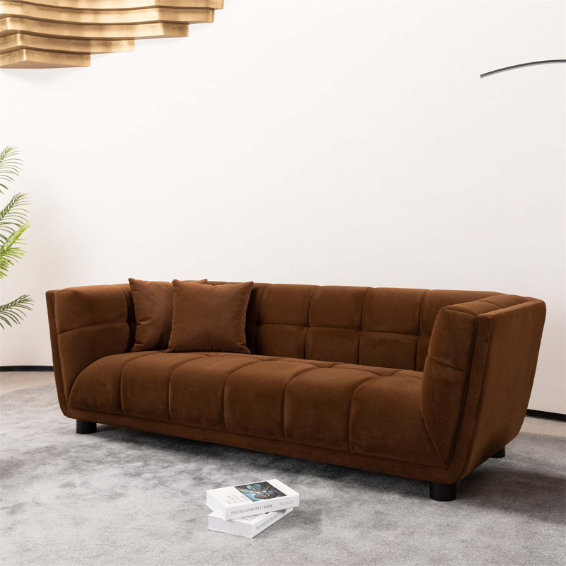 Canapé de style Mid-Century moderne avec un petit design carré, en tissu de velours lisse pour une expérience d'assise confortable et élégante.