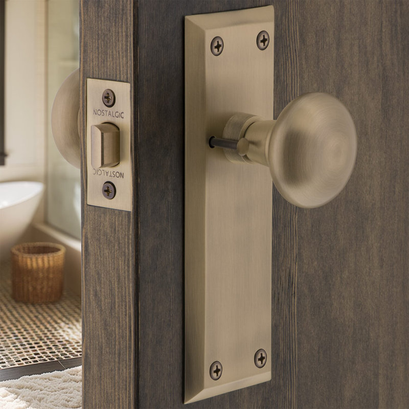 New York Plate with New York Door Knob, Antique Brass, 2-3/8"