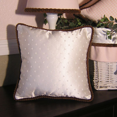 Coussin rose chocolat, Ivoire