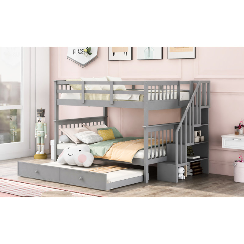 Lit superposé gris avec lit gigogne simple. Structure en bois robuste. Rangement supplémentaire.  Pour chambre à coucher ou dortoir. Aucun sommier tapissier requis. Fonctionnel