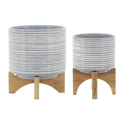 Le pot en céramique exquis avec support est un ajout étonnant à tout espace intérieur ou extérieur.