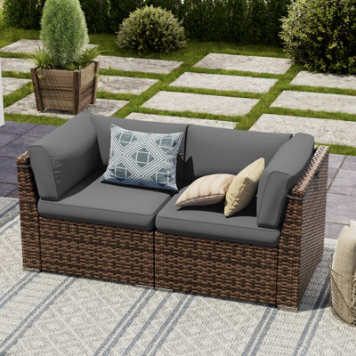 2 Piece Rattan Sectional Seating Group With Cushions