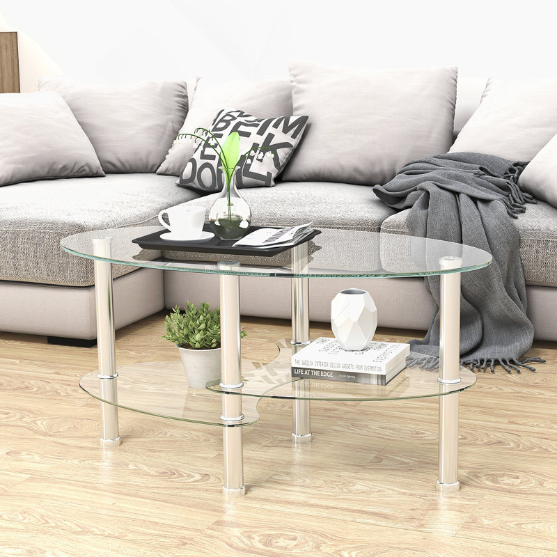 Table basse ovale avec plateau en verre et tablette